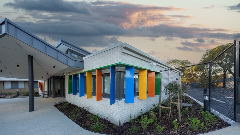 Front of QEC Noble Park Centre - Colourful Shutters