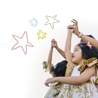 Two children dancing with parent.