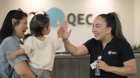 Clinician high fiving toddler
