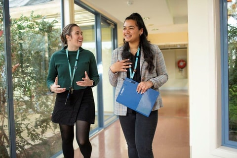 QEC staff members walking and talking around the Residential Unit.